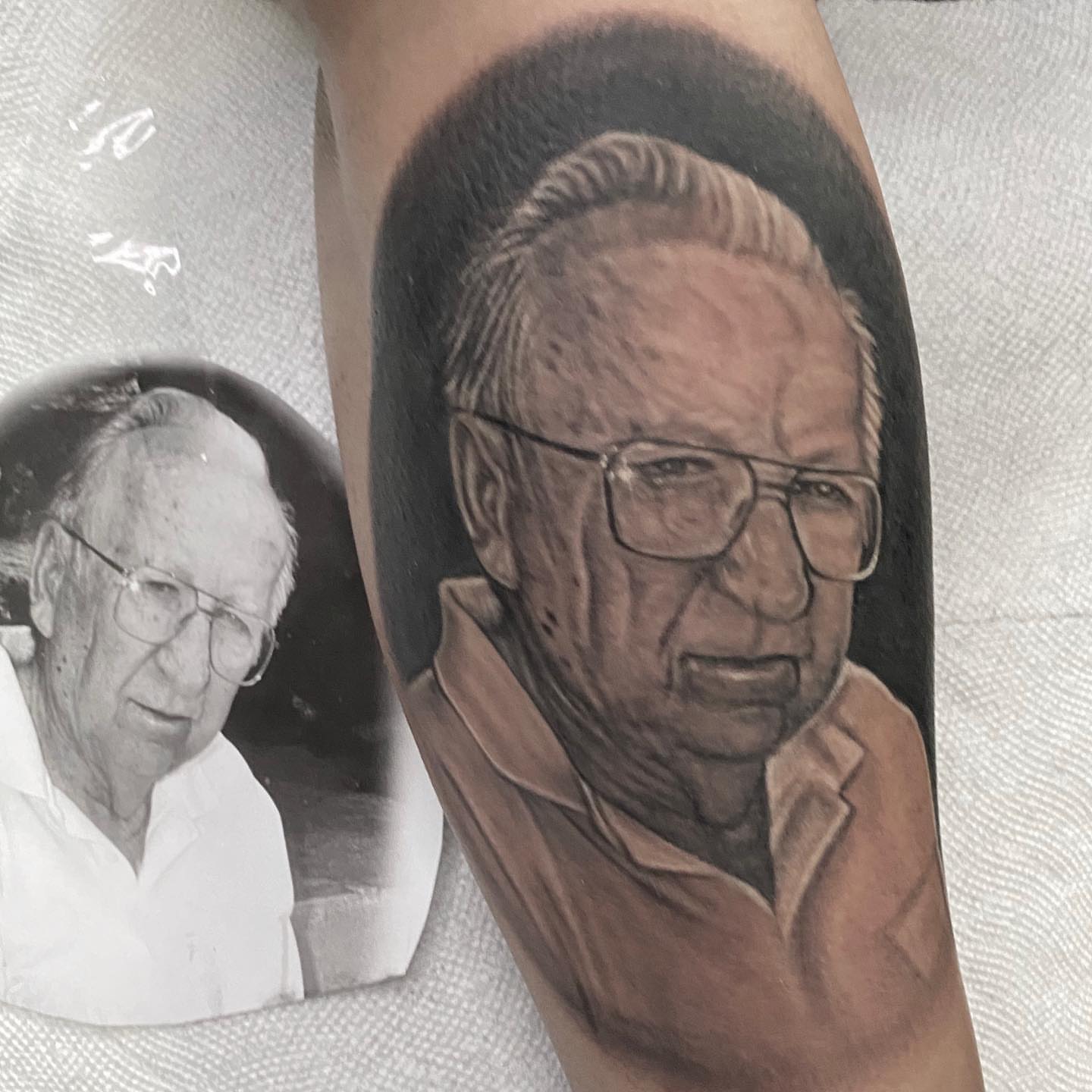 Portrait realism tattoo on the forearm by Gary Graves