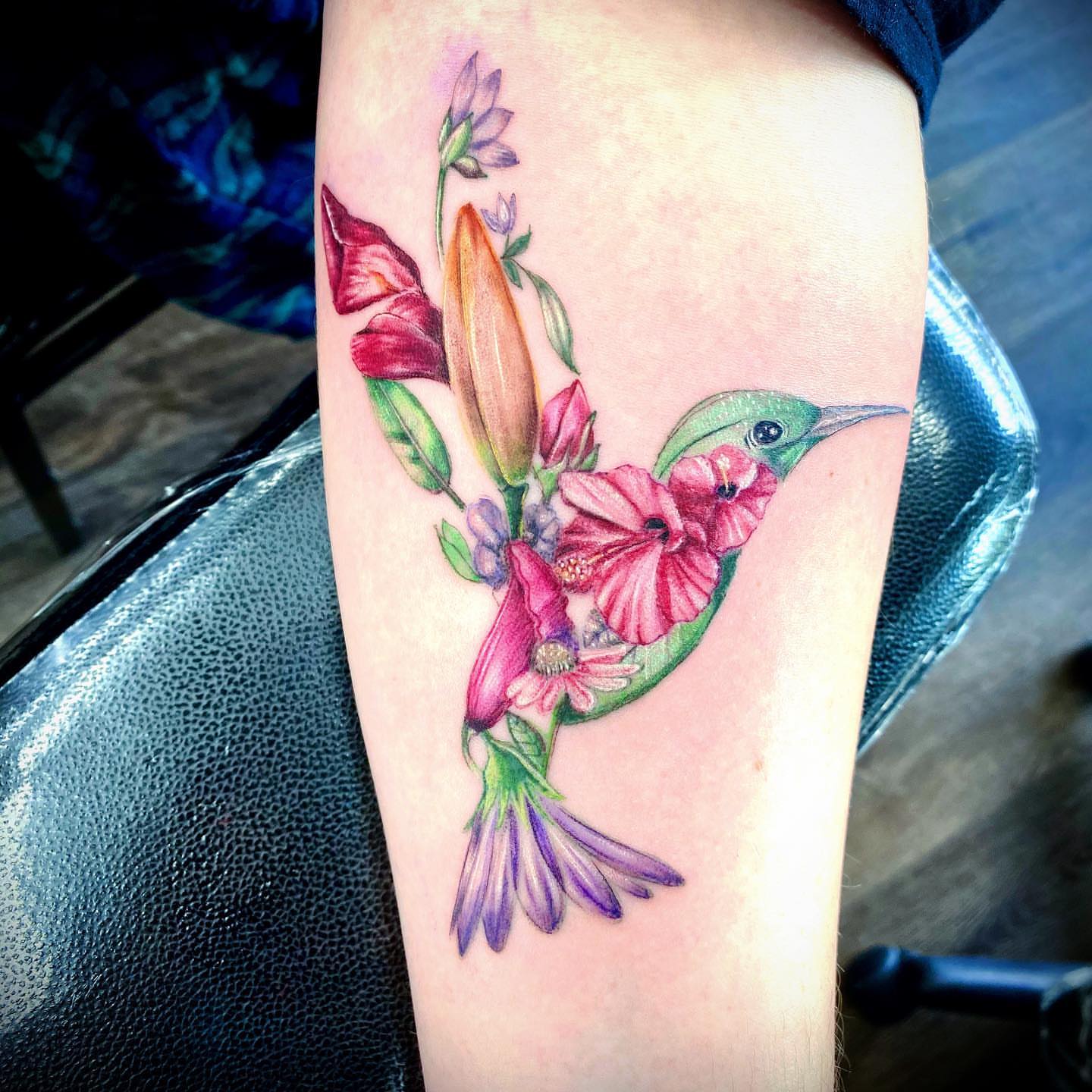 Hummingbird and flowers watercolor tattoo on the thigh by Caitlin Curtis Tattoos & Booking, Dayton, Ohio