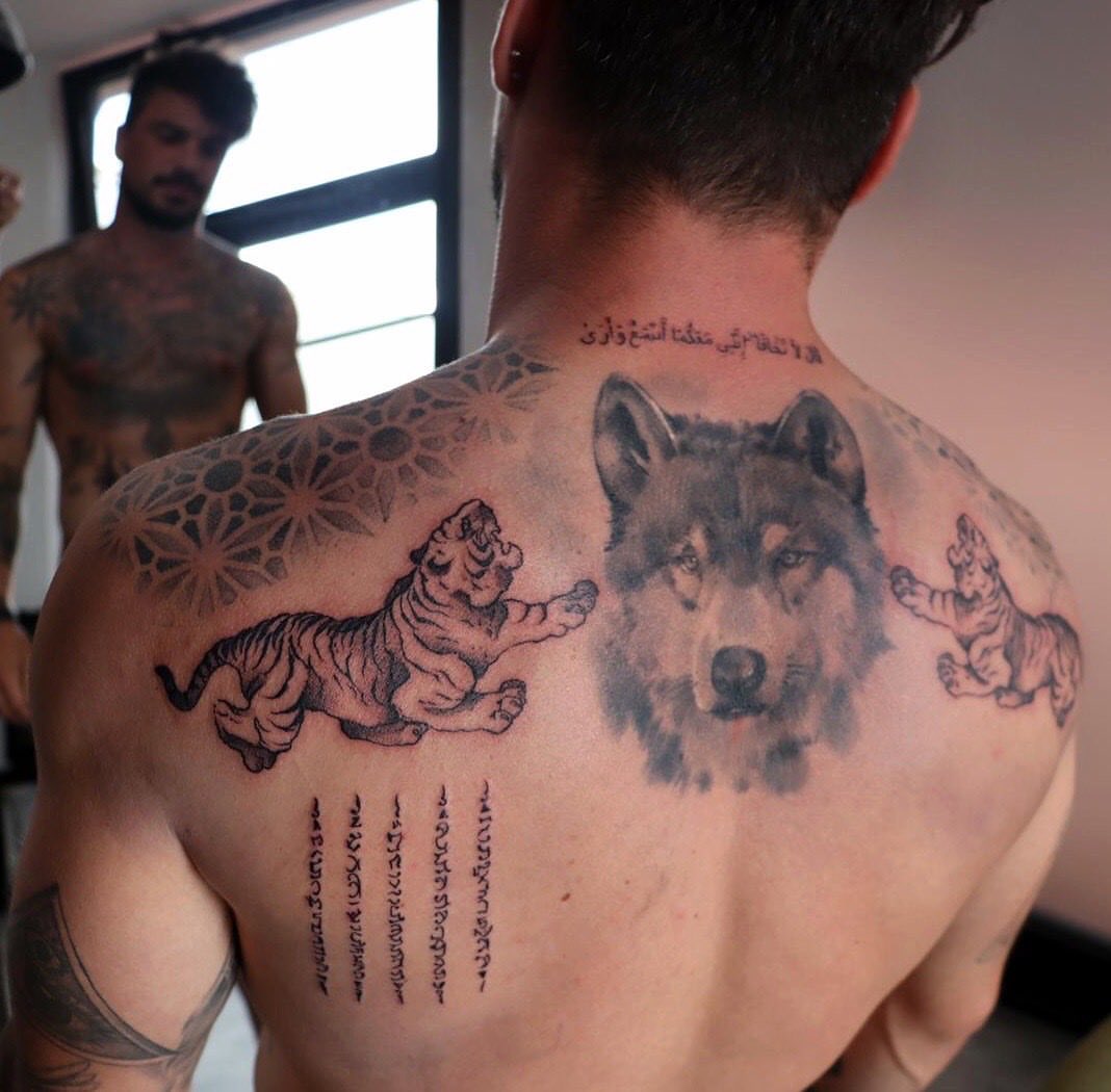Wolf and tigers realism tattoo on the back by Tattoo San Diego