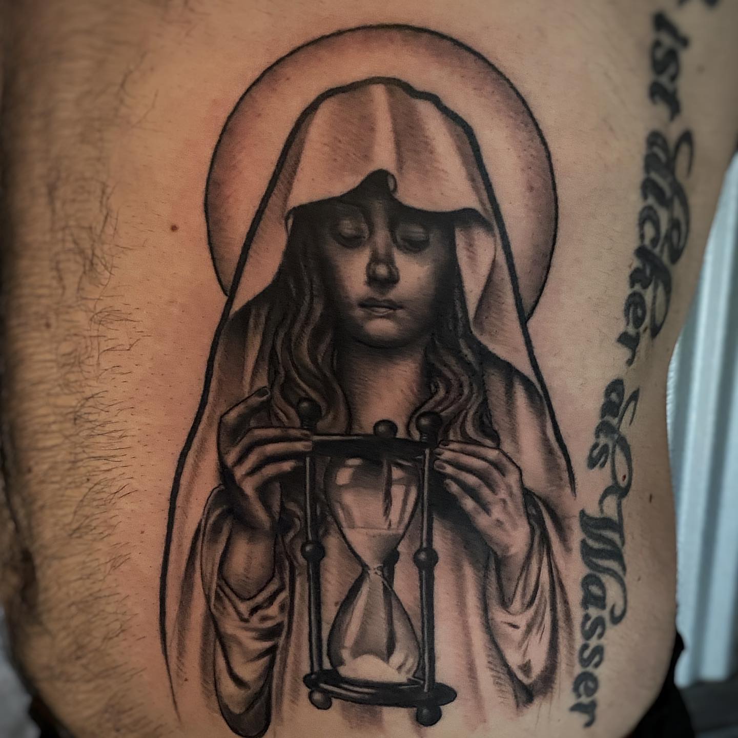 Hourglass black and grey tattoo on the chest by Bill Johenning, Lakewood, Ohio