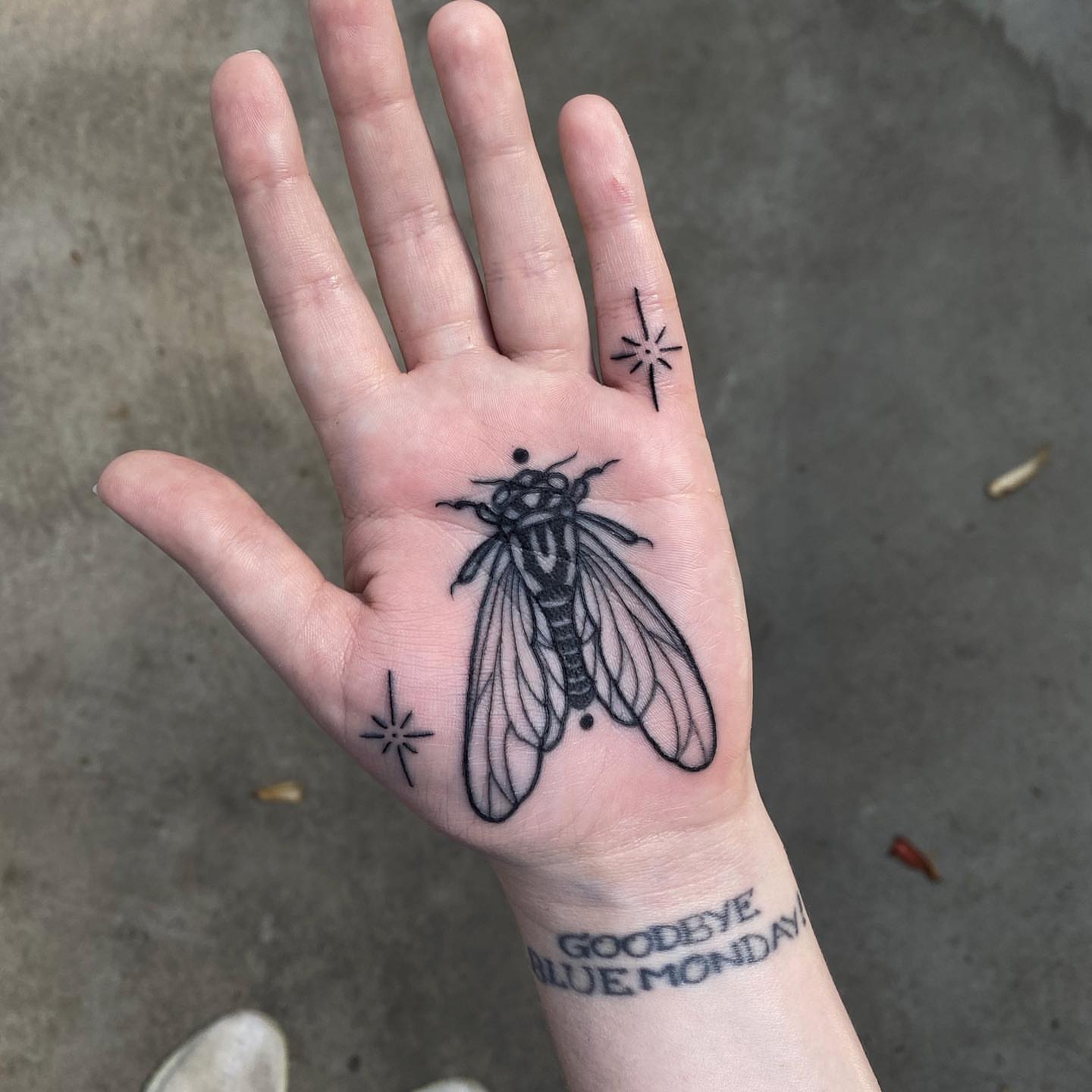 Insect black and grey tattoo on the hand by Mark Walker