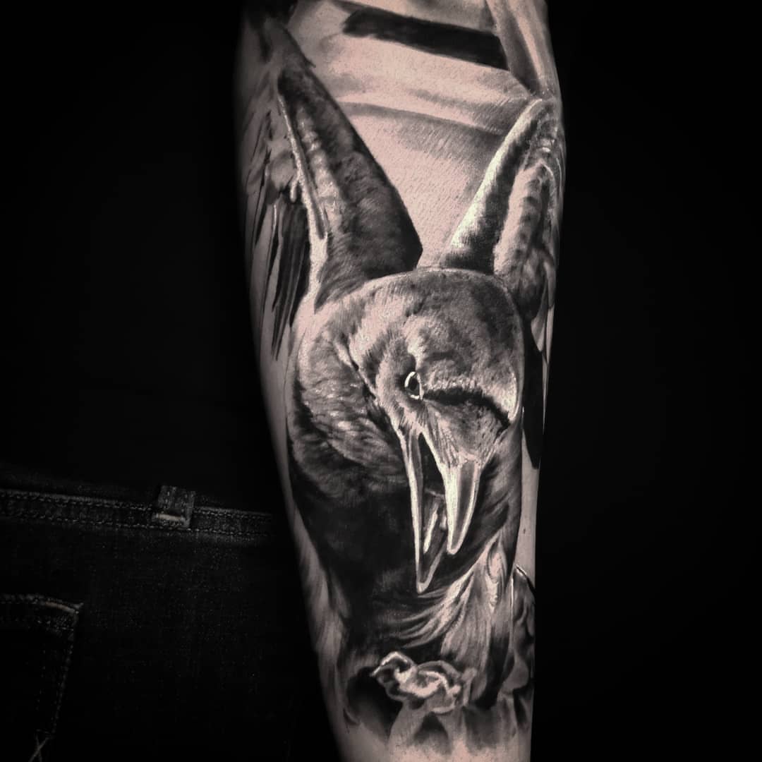 Crow realism tattoo on the forearm by Lindsay