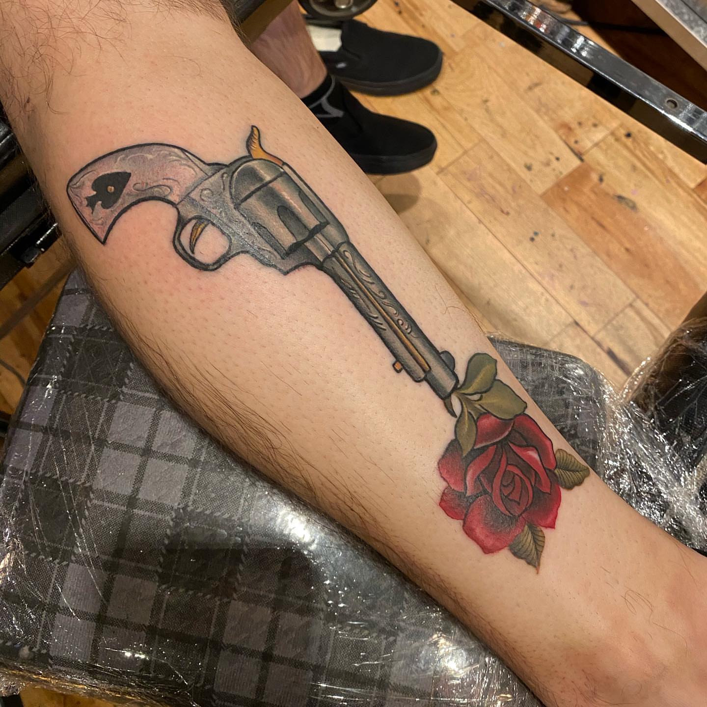Revolver and rose American traditional tattoo on the forearm by Jeff Kees