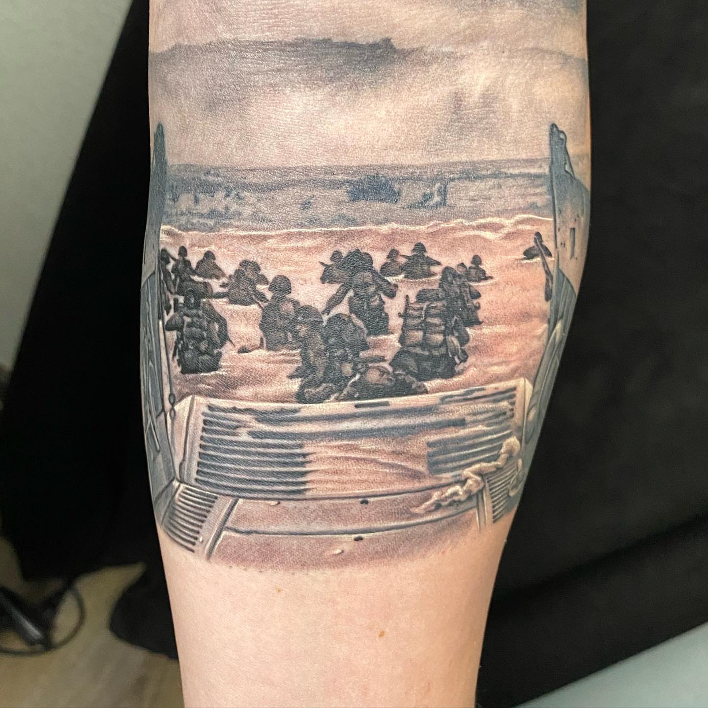 Soldiers landing realism tattoo on the forearm by Dustin Lane Collins
