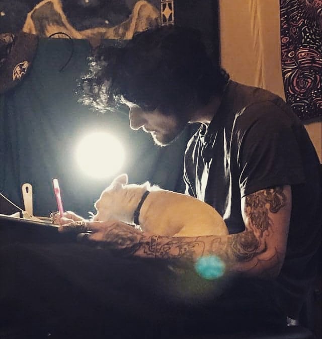 Dog American traditional tattoo on the upper arm by Louie Vee Guddah