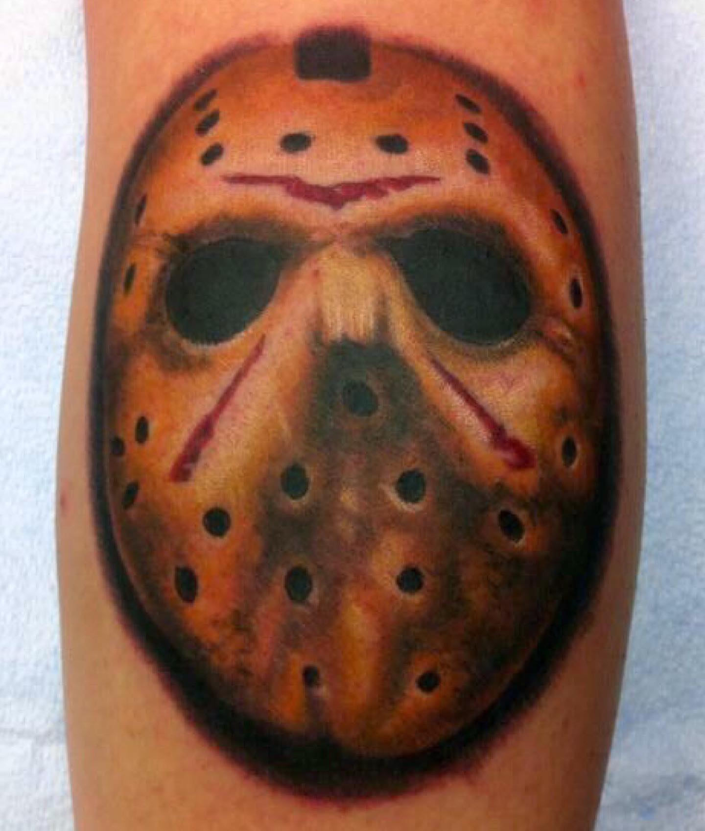 Jason voorhees mask trash polka tattoo on the forearm by Erick Campion