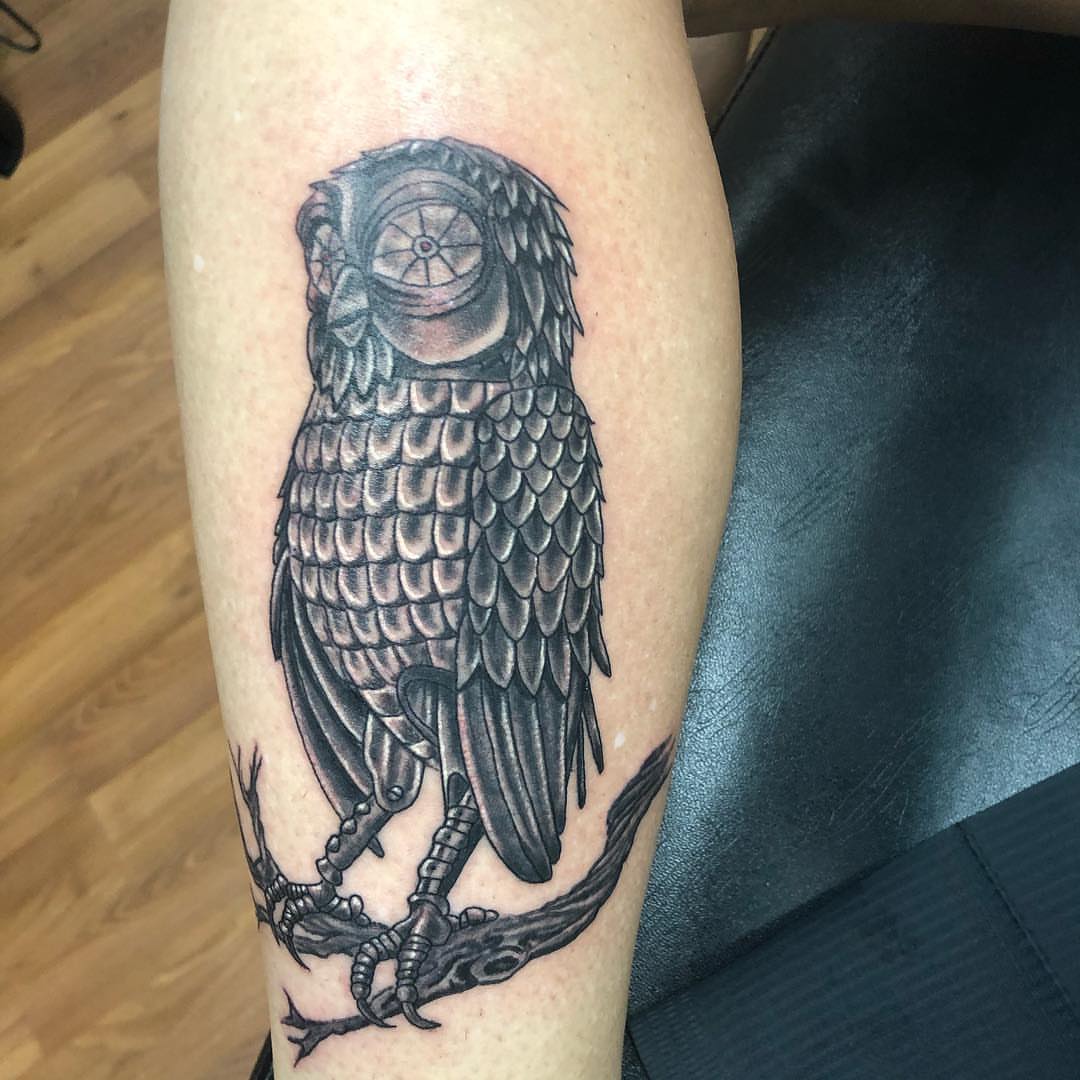 Owl black and grey tattoo on the forearm by KJ