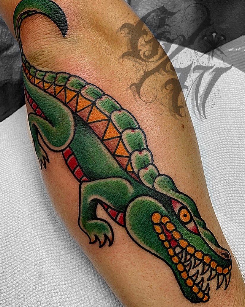 Alligator American traditional tattoo on the forearm by George Weibe