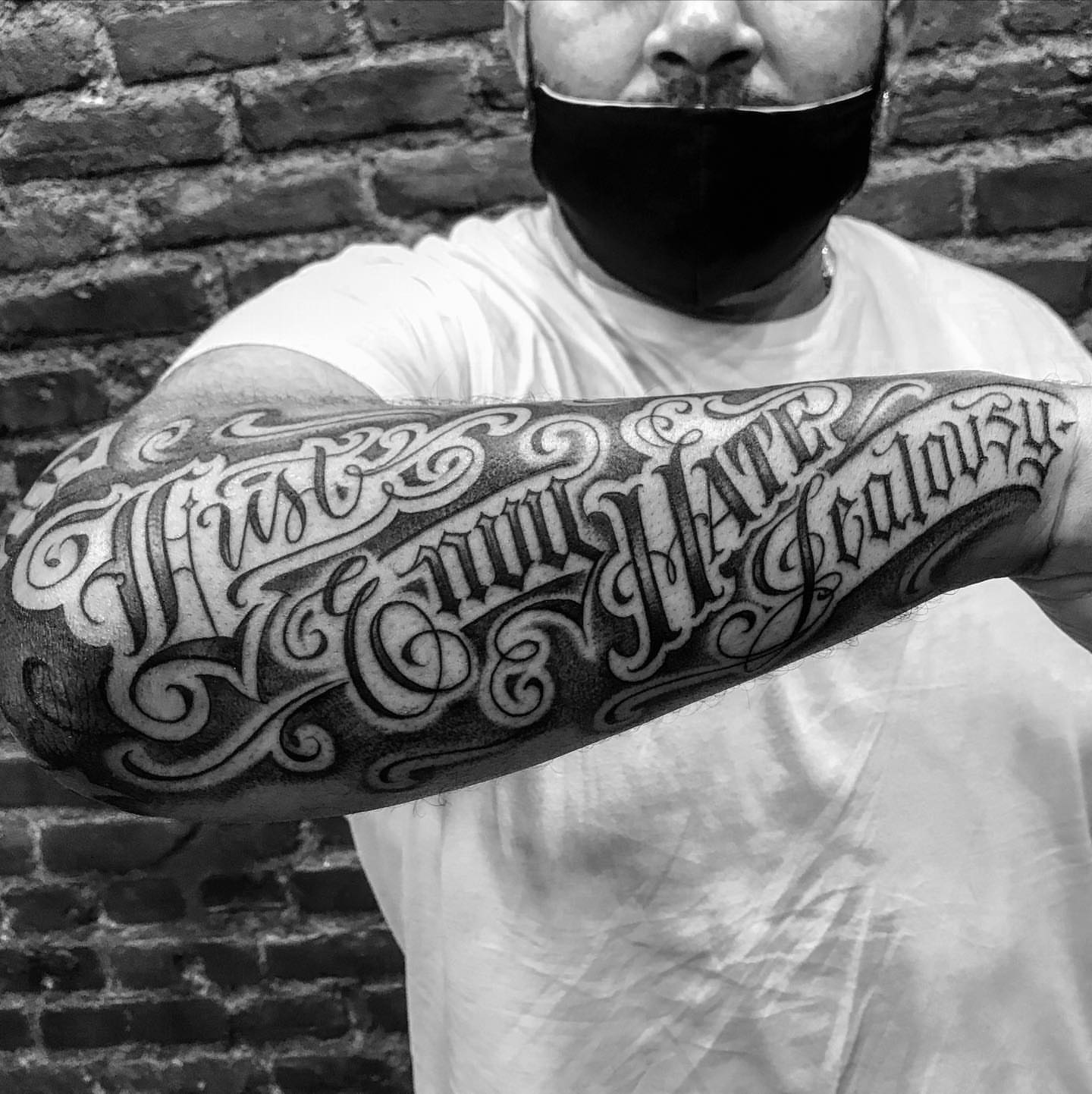 Love, hate, jealousy lettering script tattoo on the forearm by π π π β π π π π