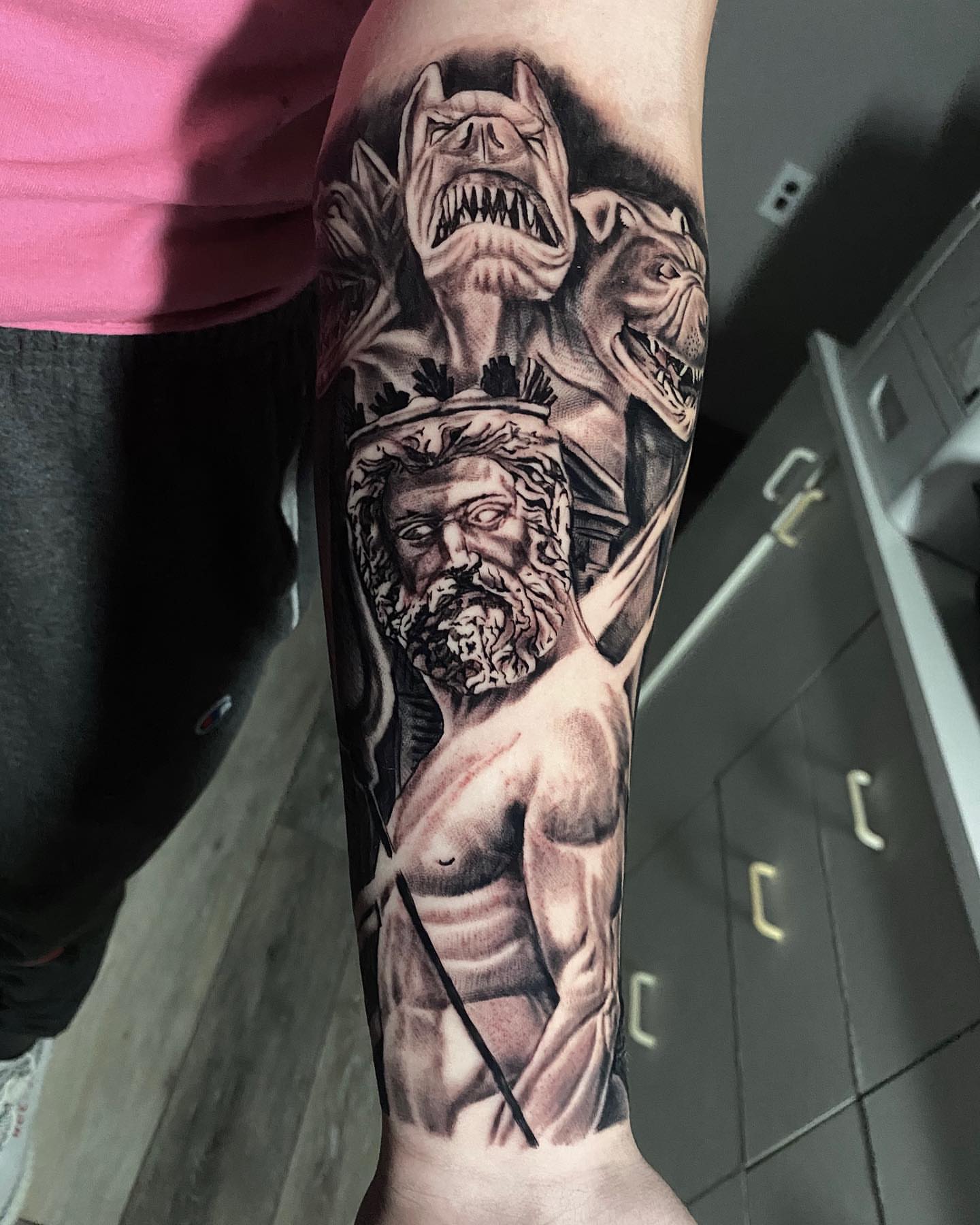 God-like figure realism tattoo on the forearm by Brian Cassidy