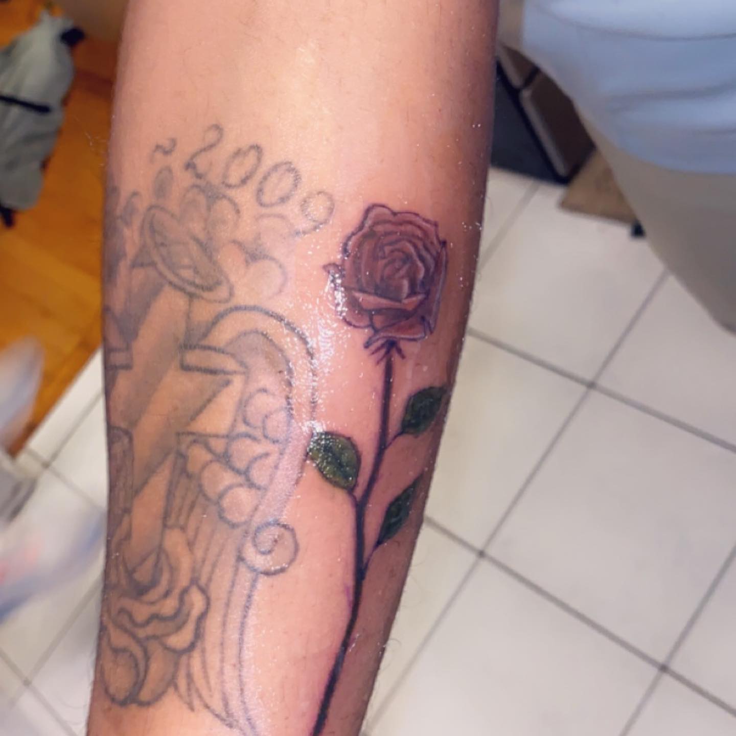 Rose black and grey tattoo on the forearm by Daniel Monyongo