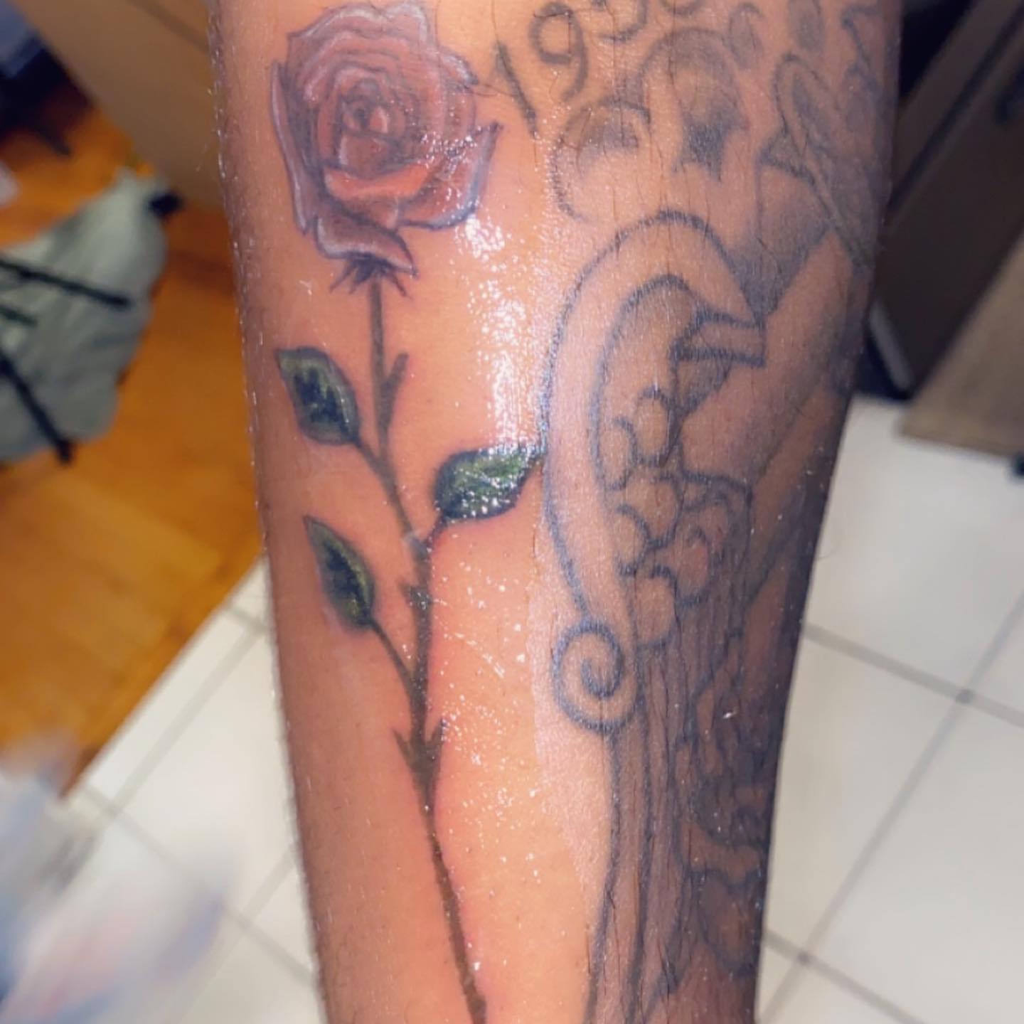 Rose and vine black and grey tattoo on the forearm by Daniel Monyongo