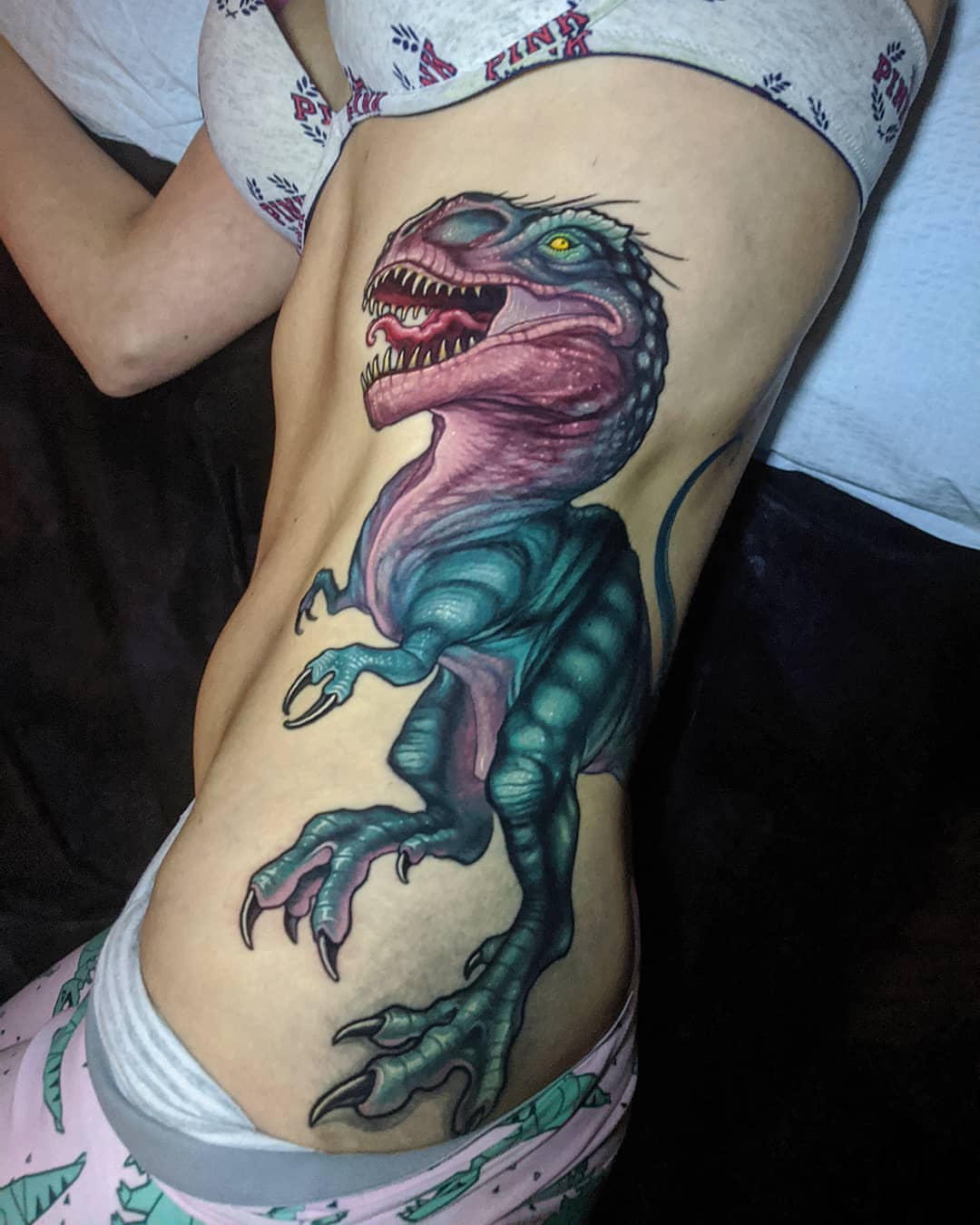 Dinosaur realism tattoo on the thigh by Matt Driscoll