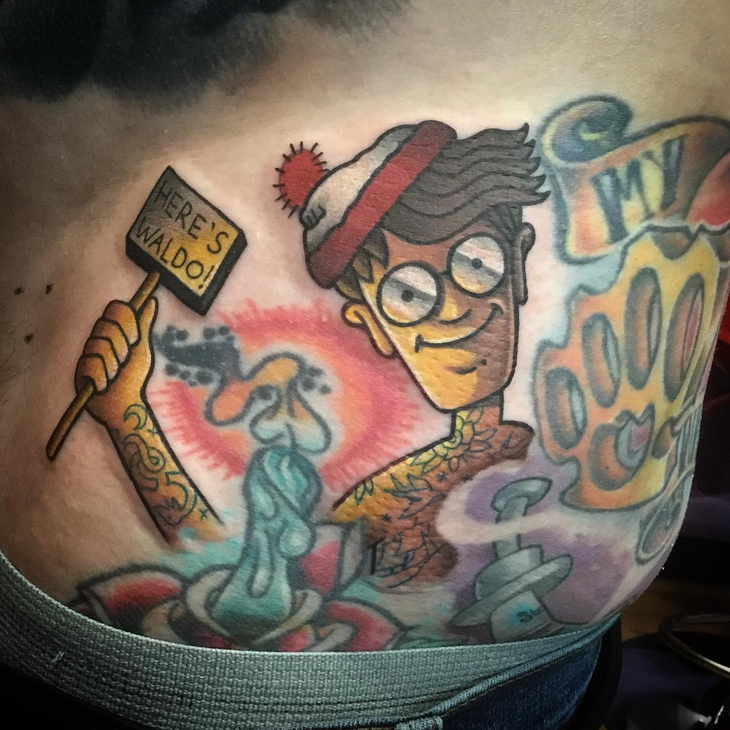 Waldo illustrative tattoo on the chest by Ariel Robinson