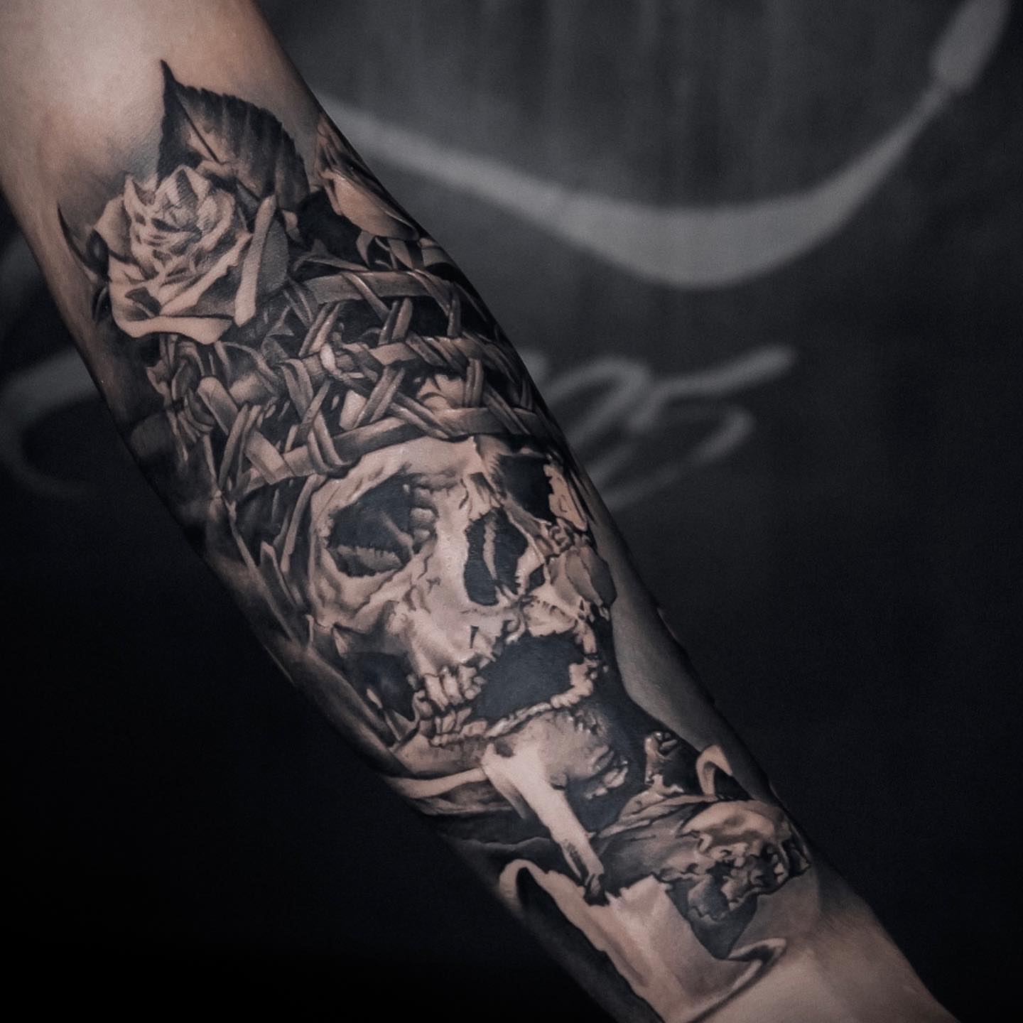 Skull and roses realism tattoo on the forearm by Duo
