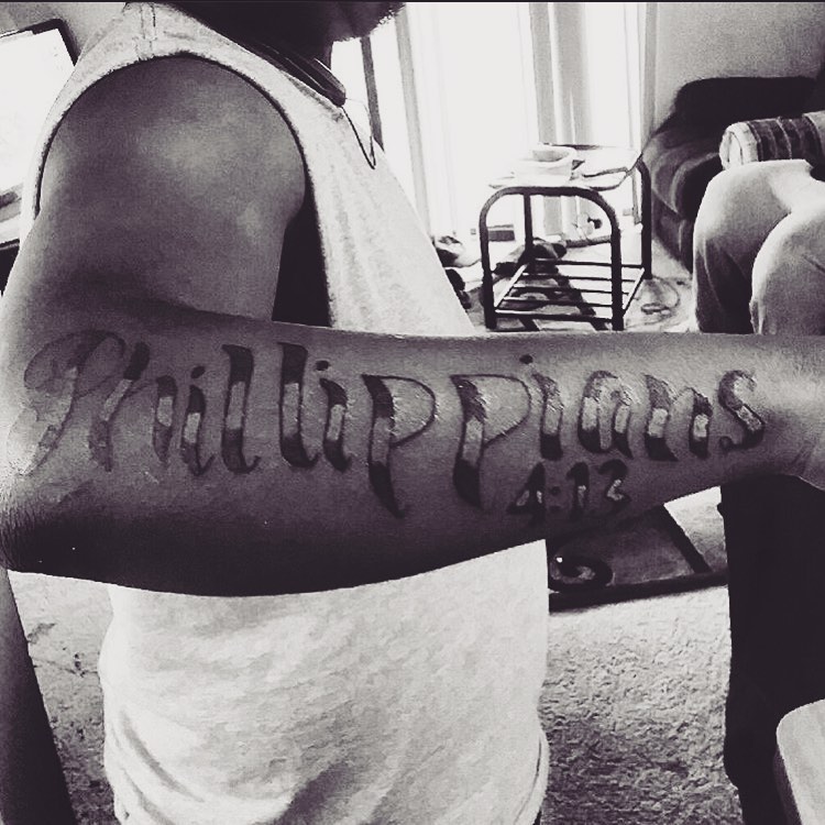 Philippians 4:12 lettering script tattoo on the forearm by Danimals