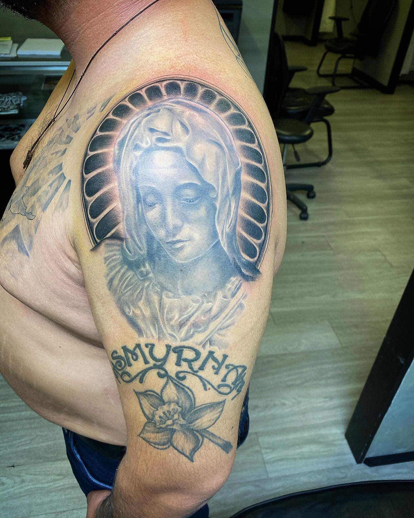 Religious figure realism tattoo on the shoulder by TattsByShorty