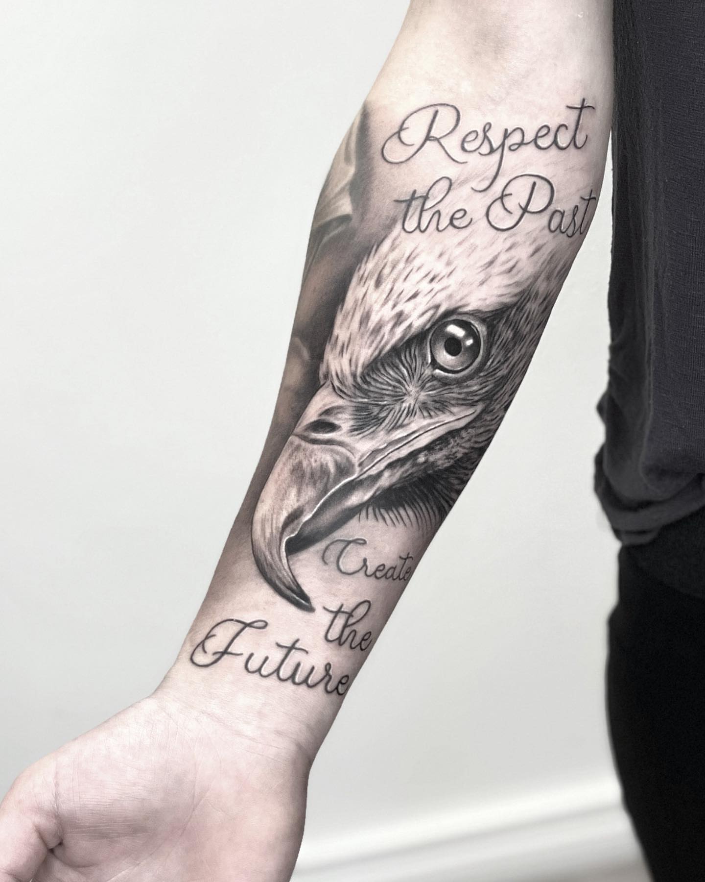 Raven head realism tattoo on the forearm by Robin Spitschan