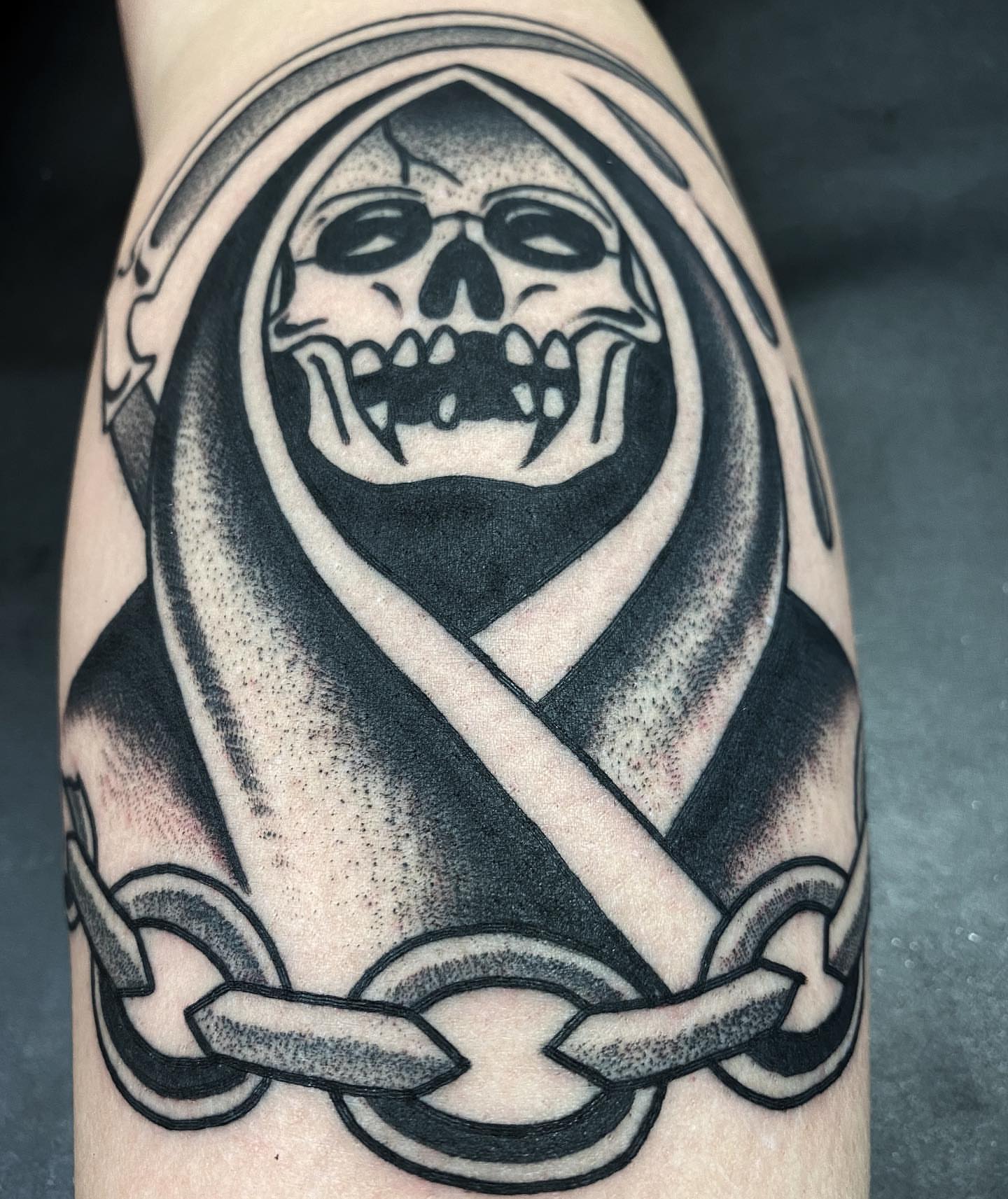 Grim reaper black and grey tattoo on the forearm by Daniel Mesen