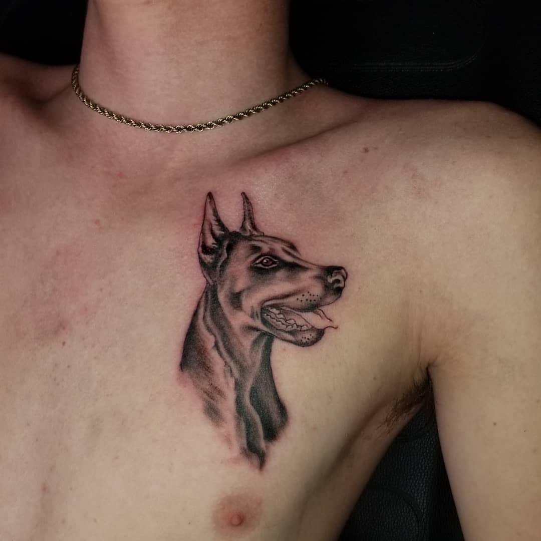 Dog realism tattoo on the chest by André Brazil