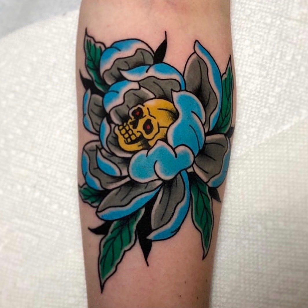 Peony with skull American traditional tattoo on the forearm by David Mendieta