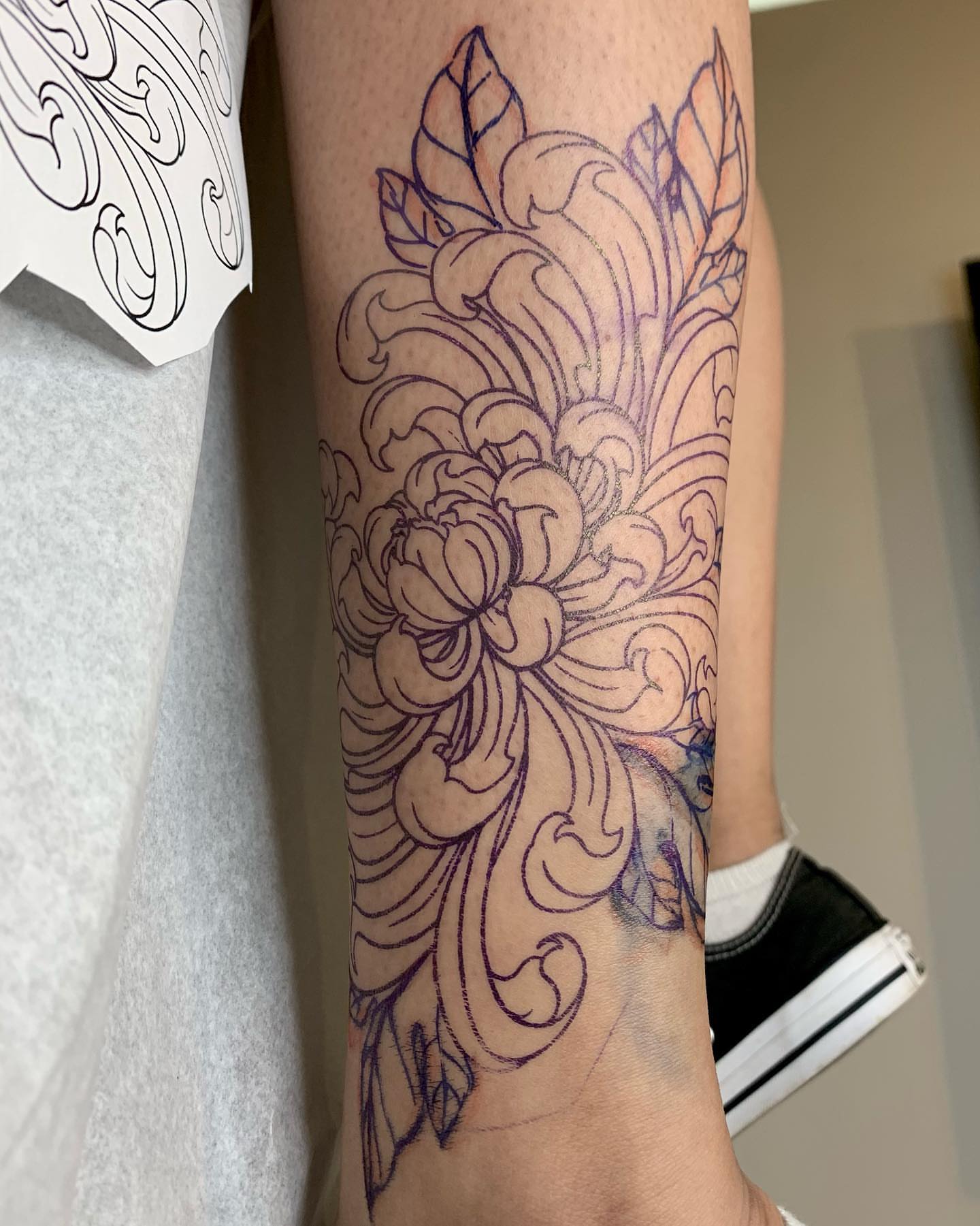 Floral design ornamental tattoo on the forearm by Chelsea Darling