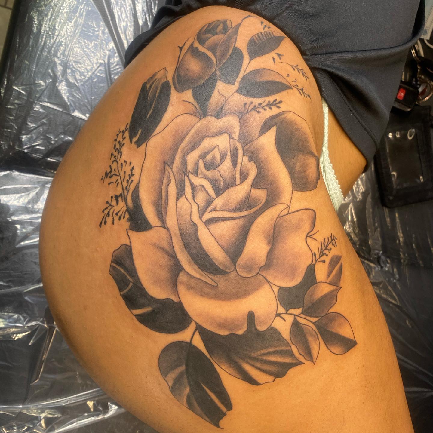Rose black and grey tattoo on the thigh by pecous