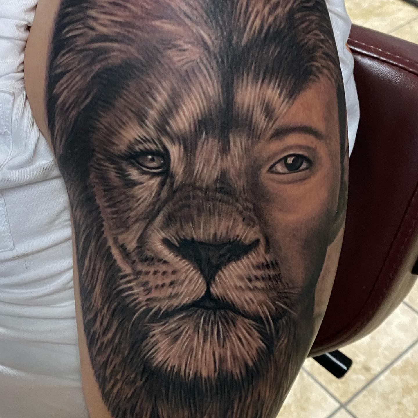 Lion realism tattoo on the forearm by Gary Graves