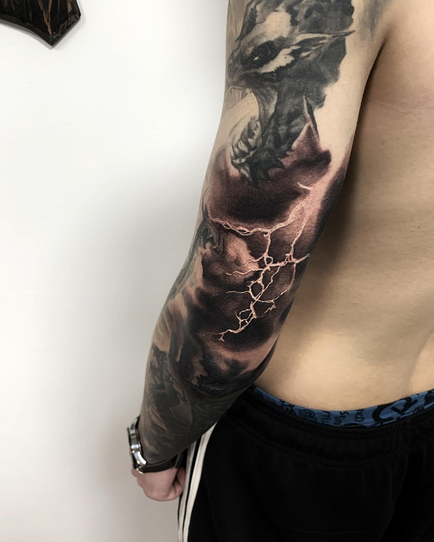 Dragon realism tattoo on the forearm by Anastasia Ritova