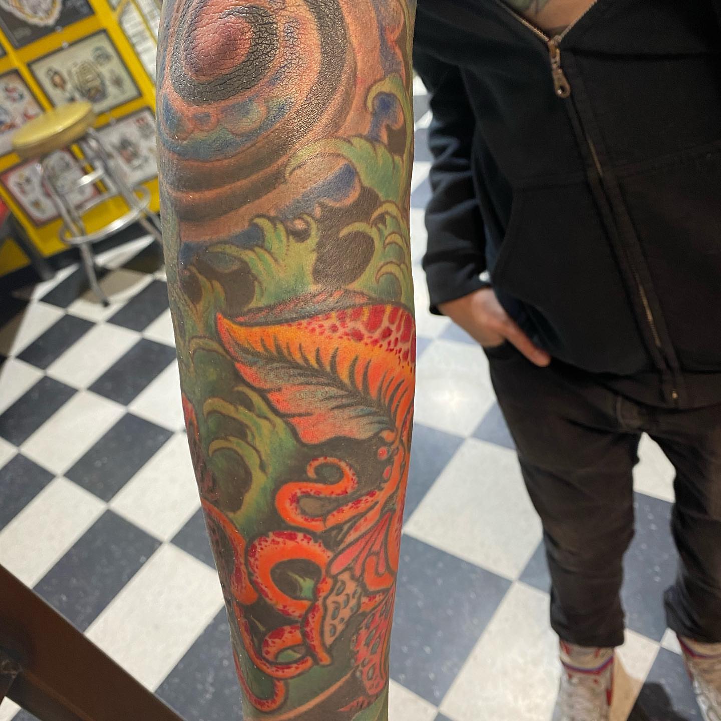 Octopus new school tattoo on the forearm by Edward Choat