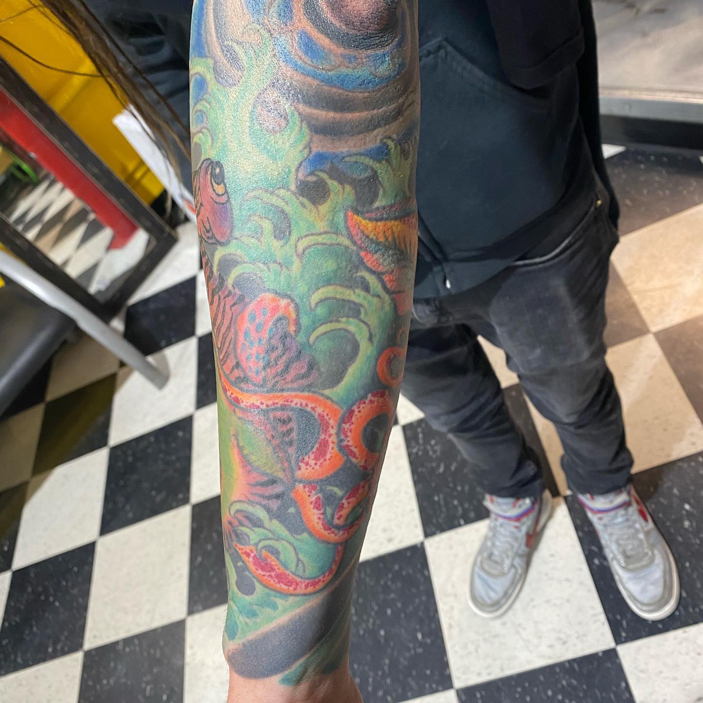 Octopus new school tattoo on the forearm by Edward Choat