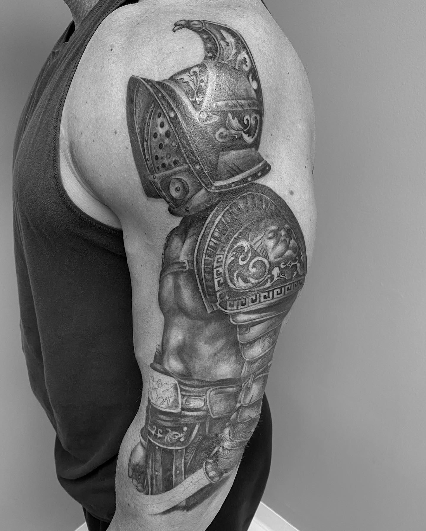 Ancient warrior realism tattoo on the shoulder by mike hudson