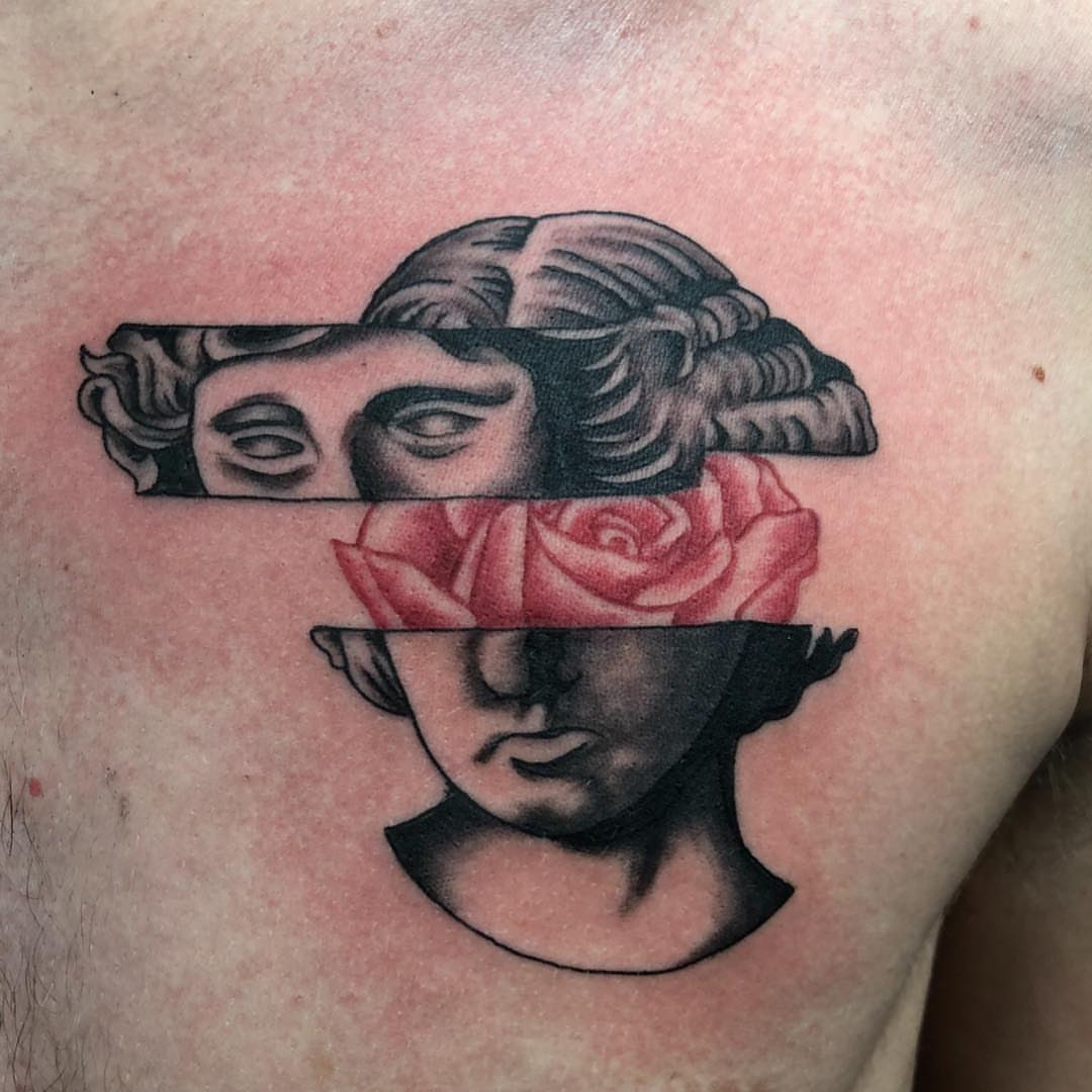 Woman's face with rose geometric tattoo on the chest by KJ