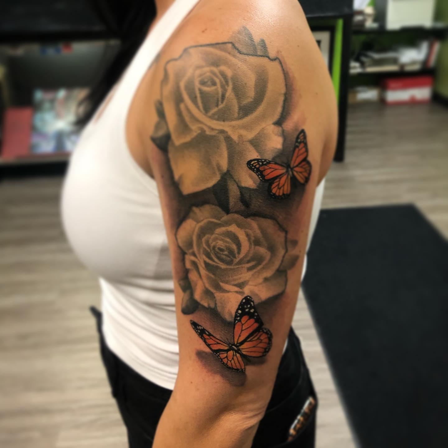 Roses and butterflies realism tattoo on the forearm by Nick Jones (Buttonsandfaders)