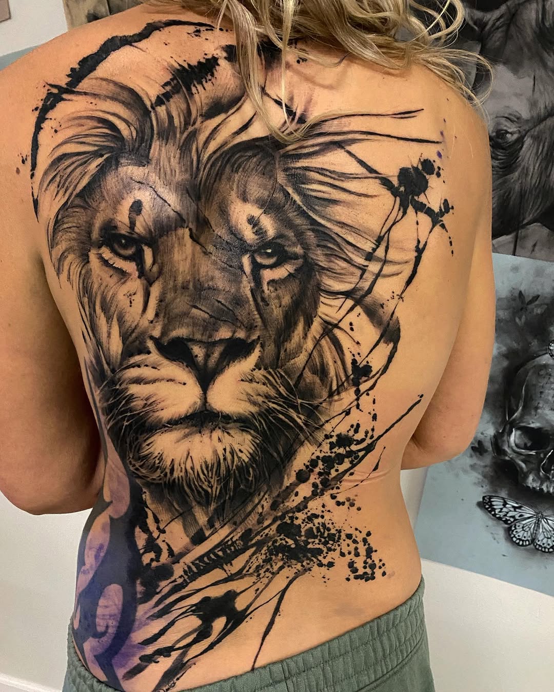 Lion face with abstract elements sketch tattoo on the back by David Garner, Los Angeles, California