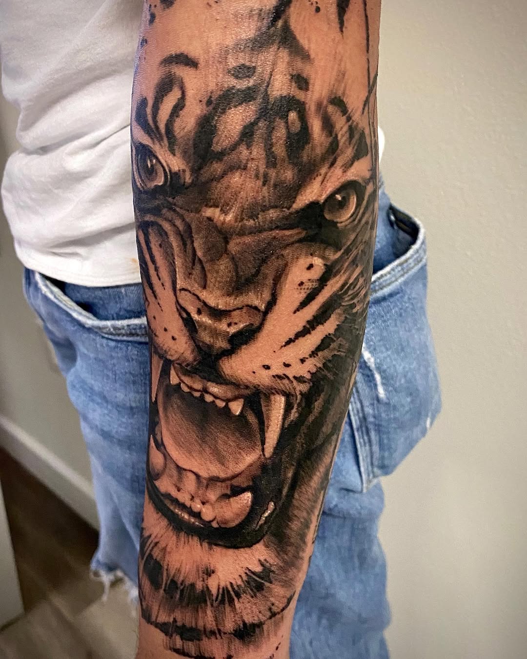 Tiger face realism tattoo on the forearm by David Garner, Los Angeles, California