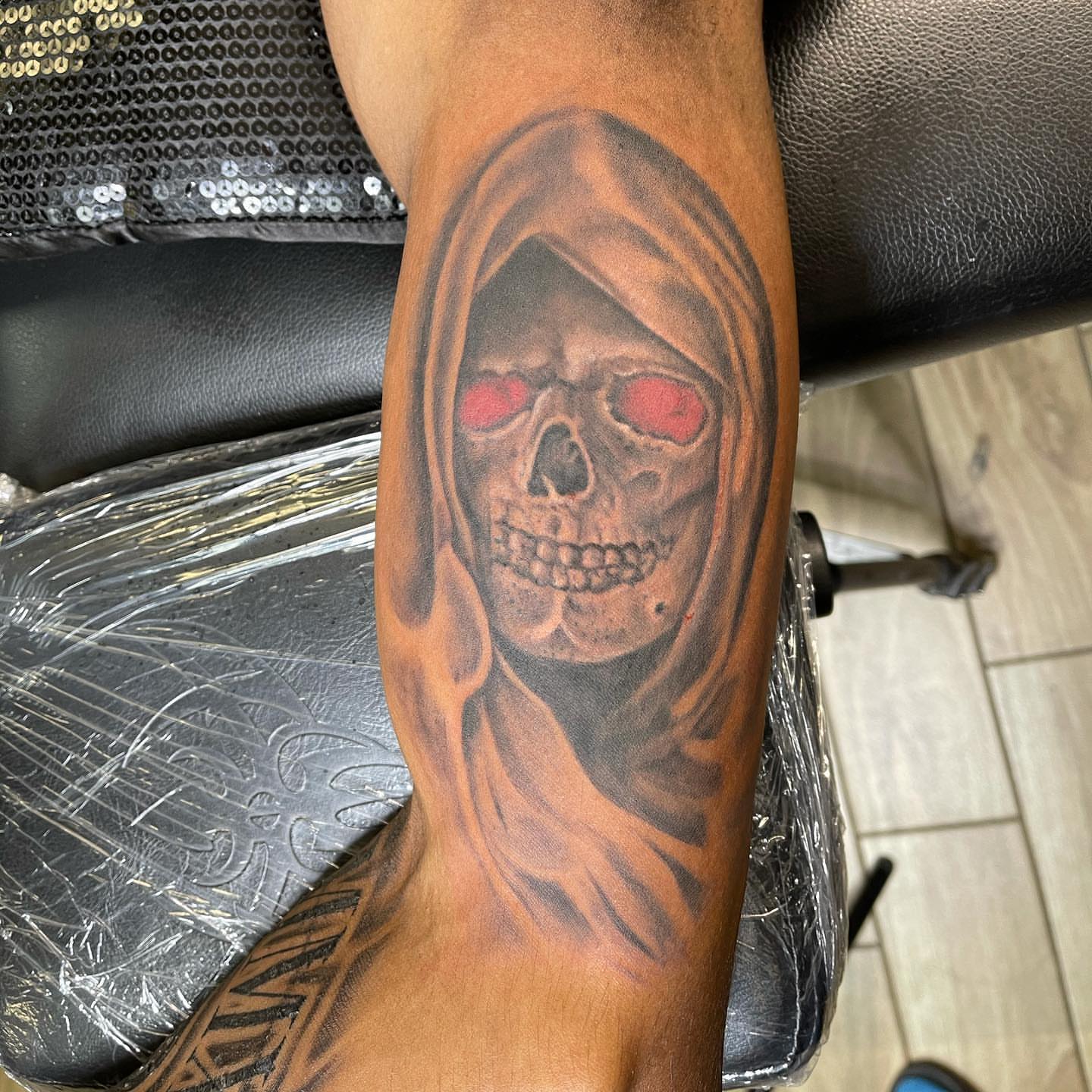 Grim reaper dark realism tattoo on the forearm by pecous