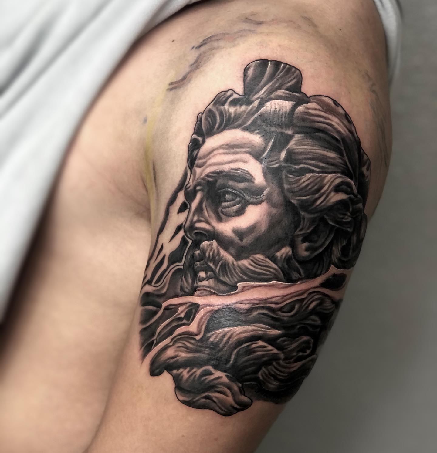 Bearded man realism tattoo on the shoulder by Daniel Gutierrez