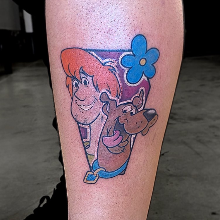Shaggy and scooby-doo illustrative tattoo on the forearm by Madison Ast Tattoo