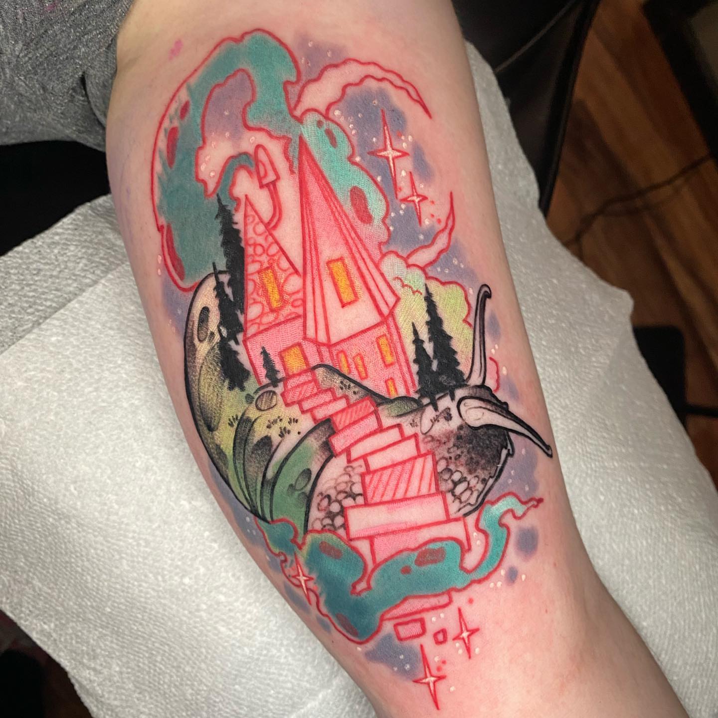 Castle and landscape new school tattoo on the forearm by Kara Klenk