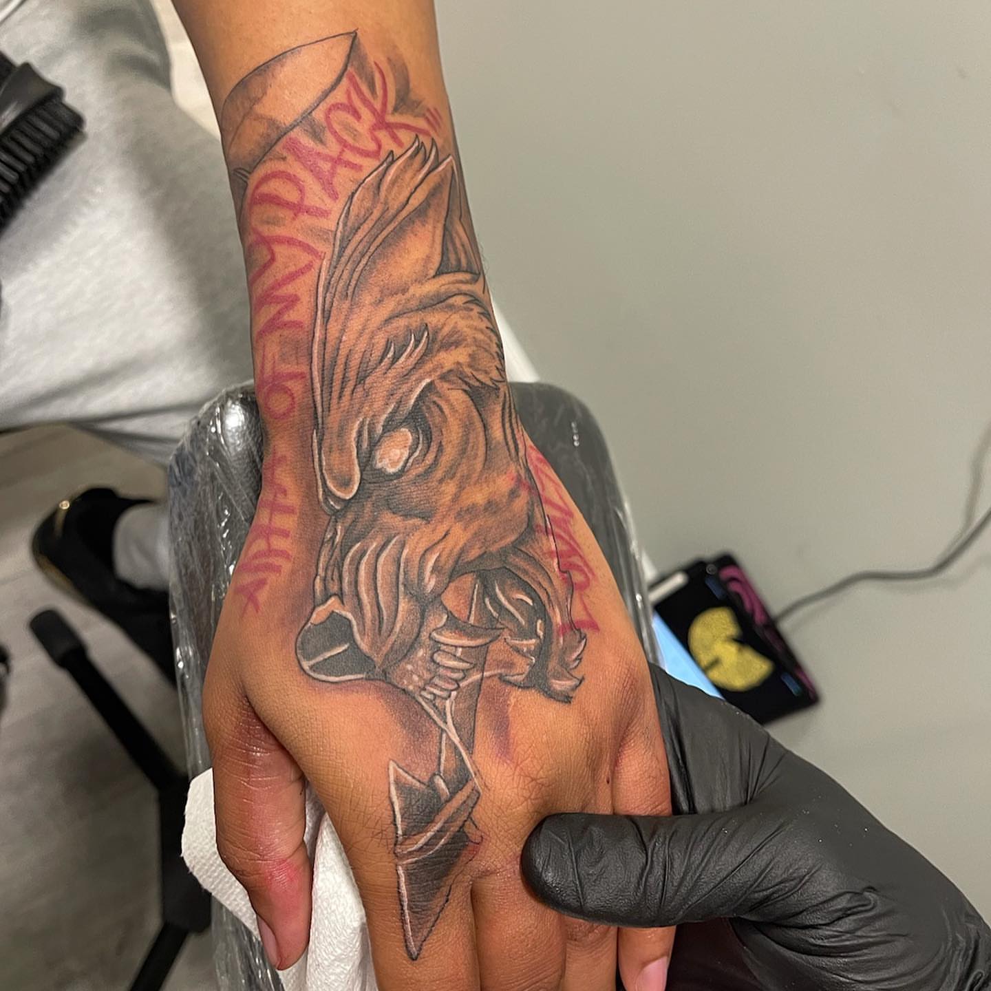 Wolf head realism tattoo on the hand by Daniel Illachek