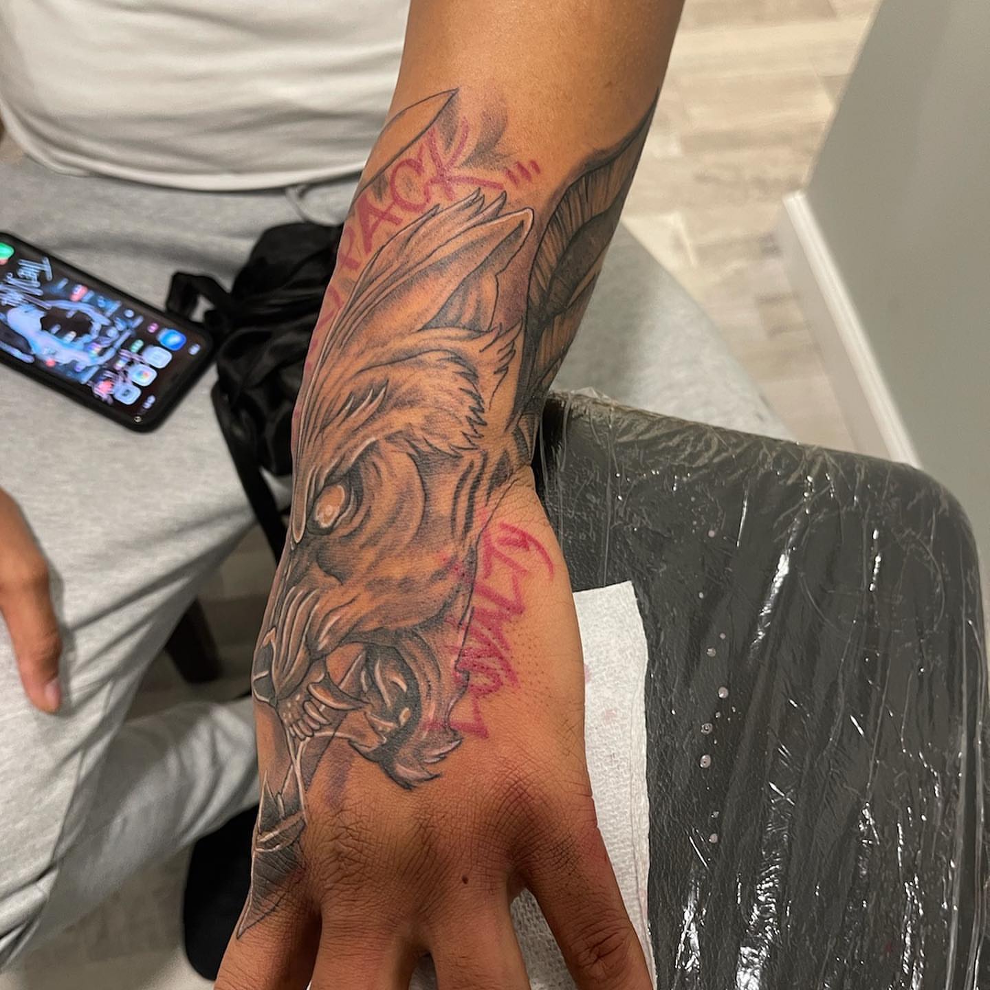 Wolf realism tattoo on the hand by Daniel Illachek
