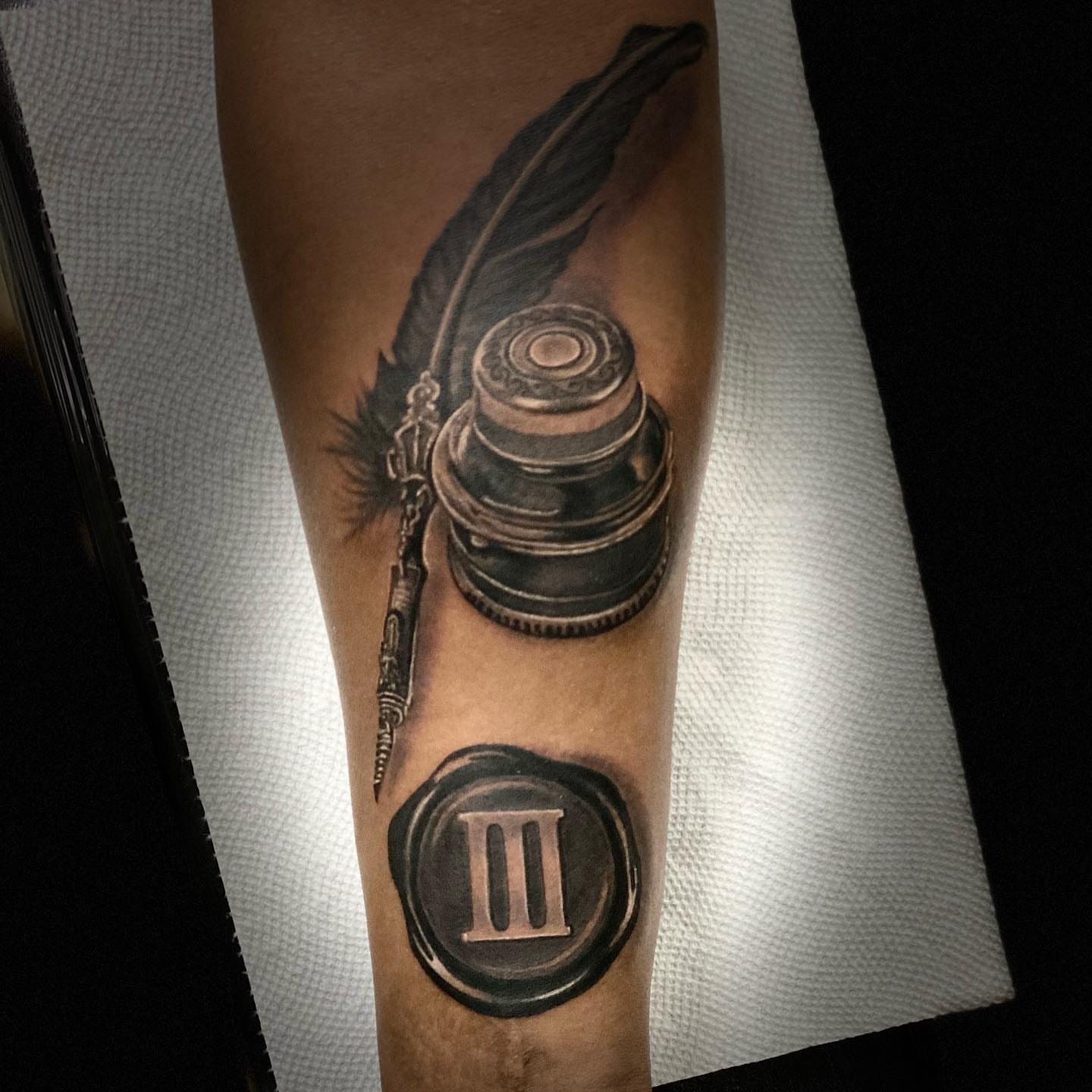 Quill and inkwell realism tattoo on the forearm by Gary Graves