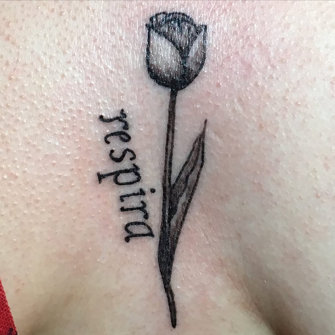 Tulip and lettering fine line tattoo by Rhonda Faber Green