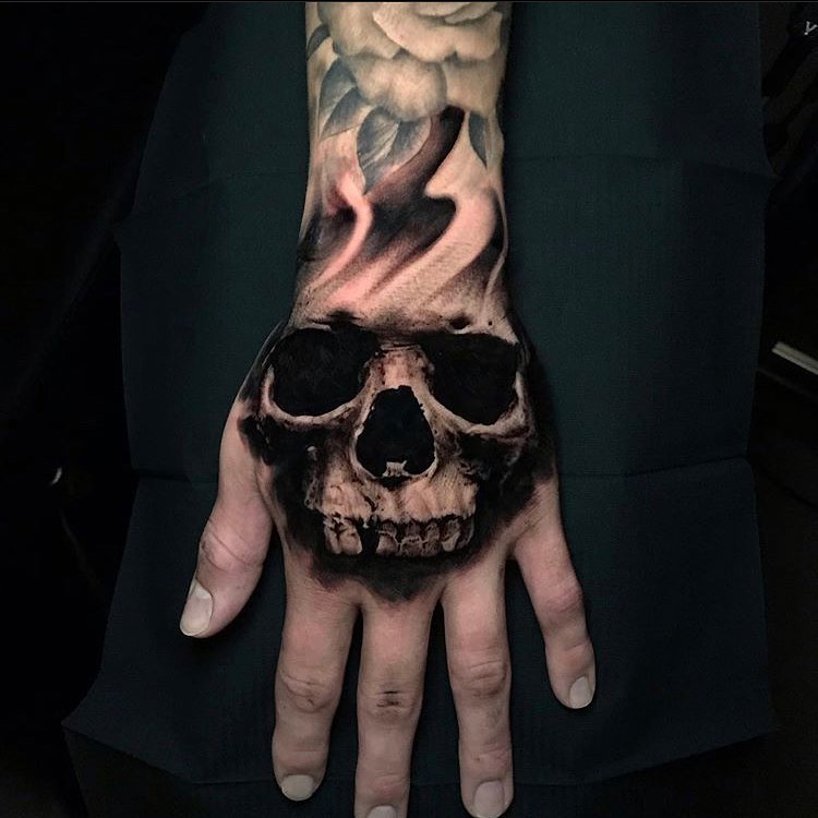 Skull and rose realism tattoo on the hand by Aren