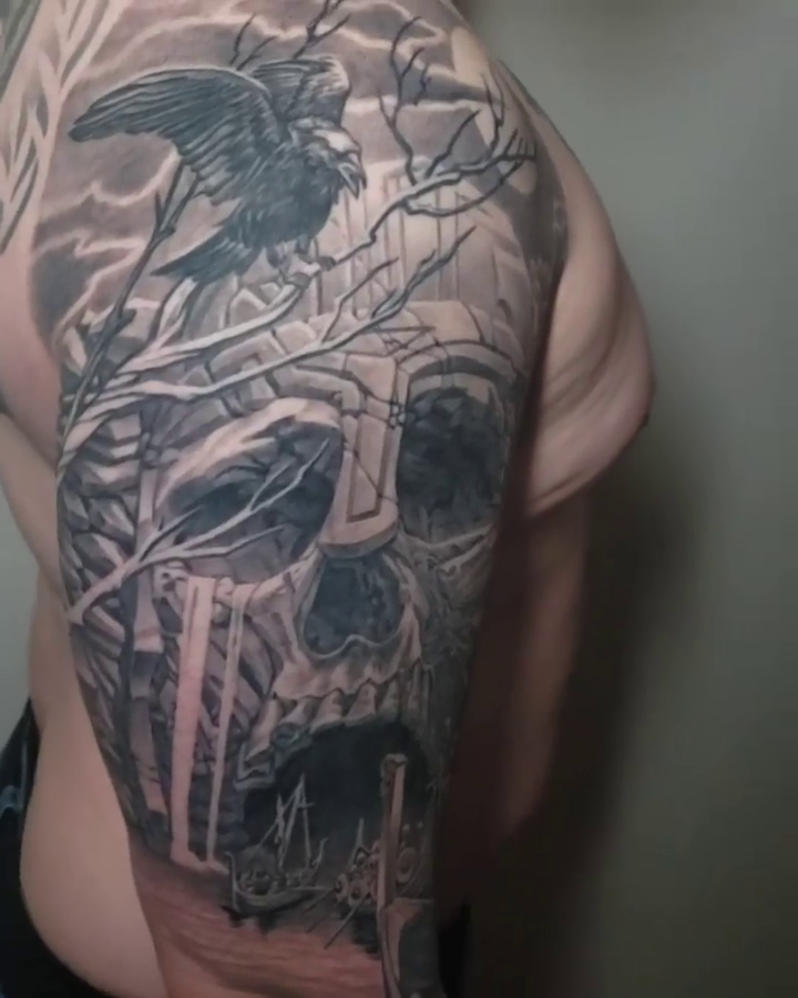 Viking skull with raven and ship dark realism tattoo by Walt Watts, Salt Lake City, Utah