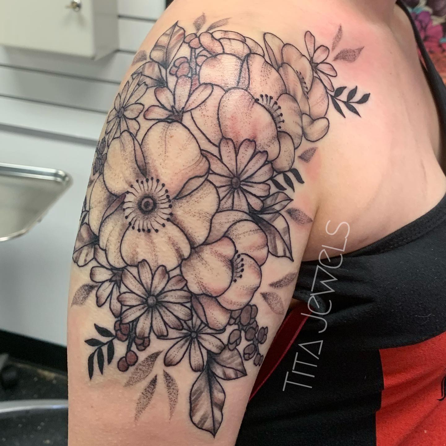 Floral bouquet black and grey tattoo on the shoulder by Tita Jewels- Tattoo Artist, Austin, Texas