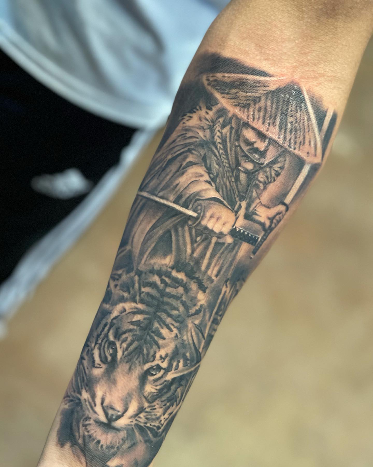 Samurai warrior with tiger realism tattoo on the forearm by Mikeyftsk2