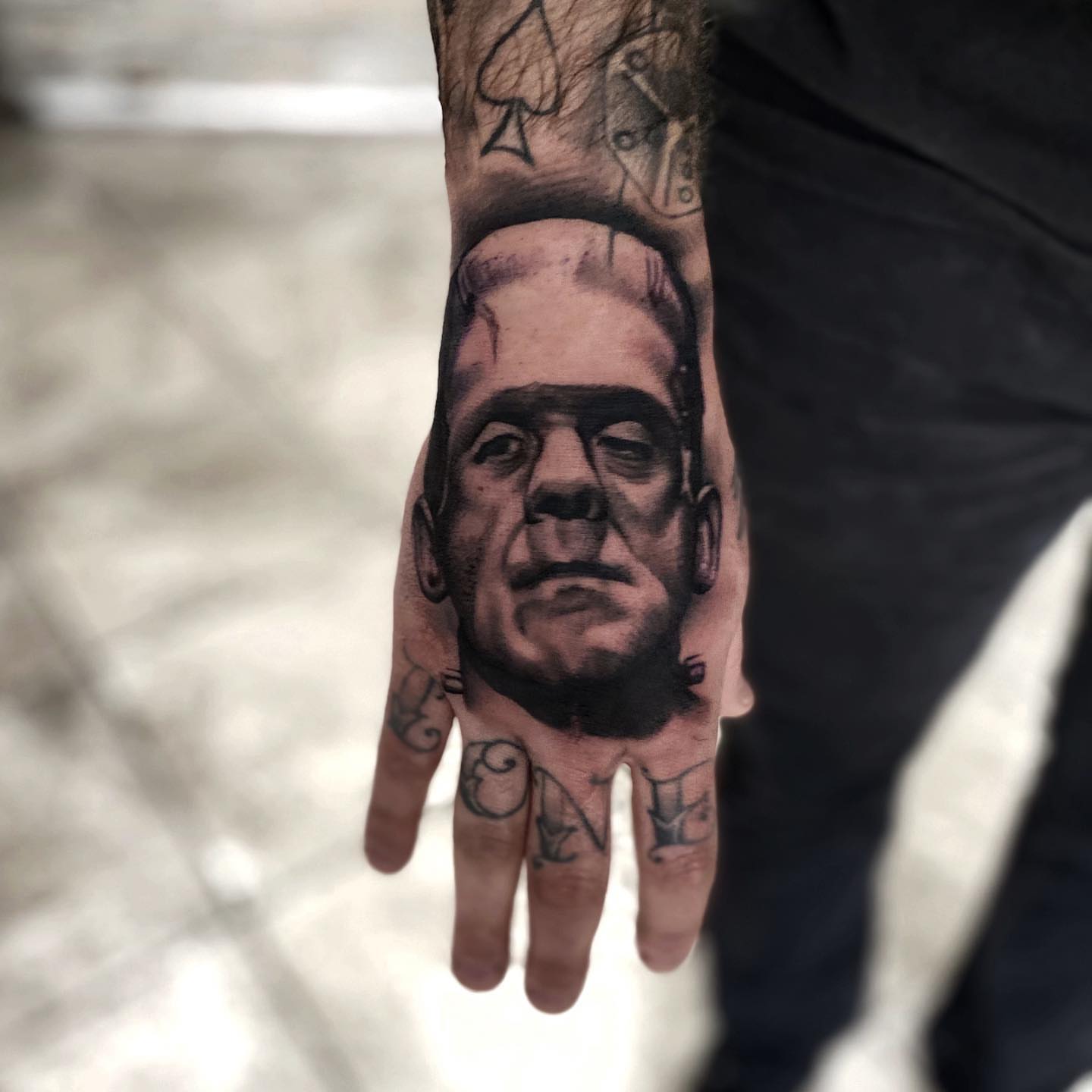 Frankenstein's monster realism tattoo on the hand by Aaron Carey, Salem, Oregon