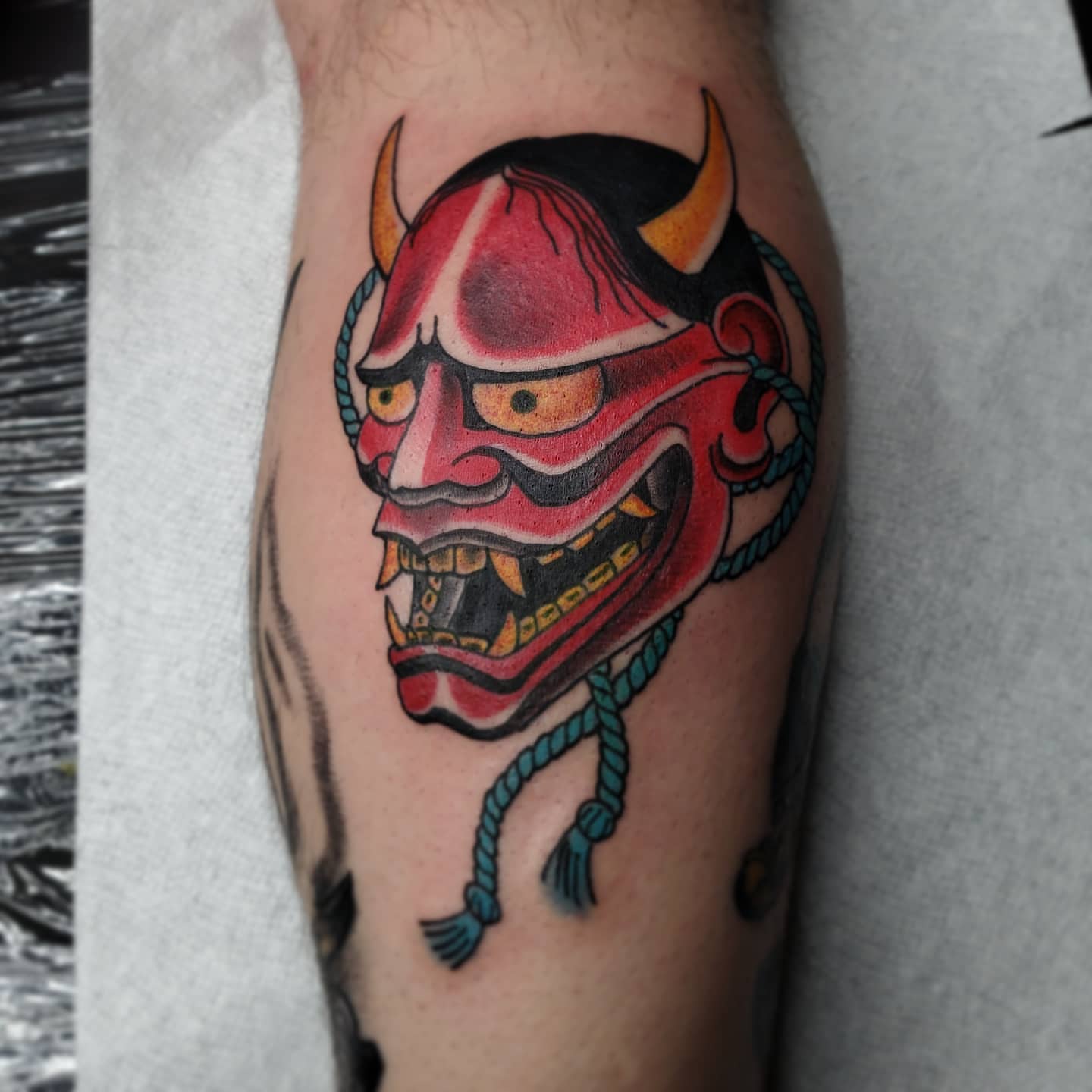 Demon mask American traditional tattoo on the forearm by TattoosbyPhatboi